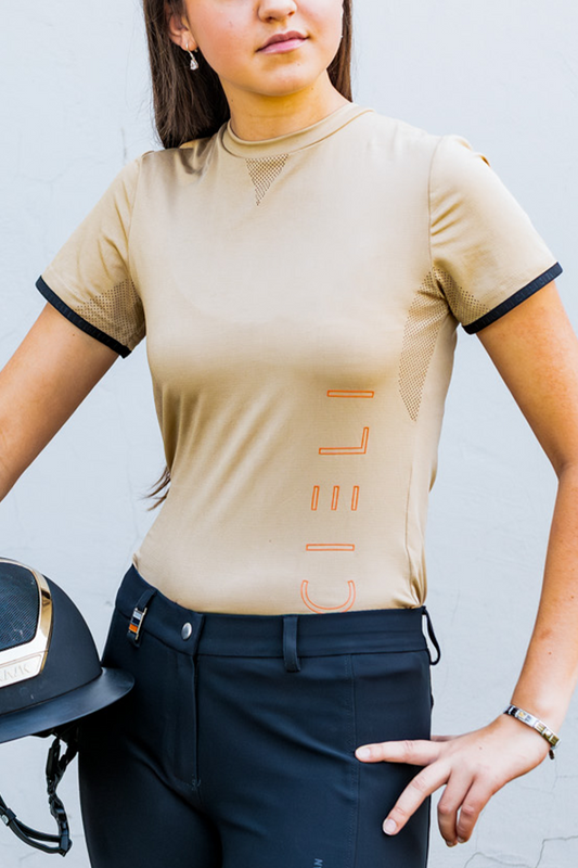 Person wearing a mocha shirt with 'Cieli' branding against a light background