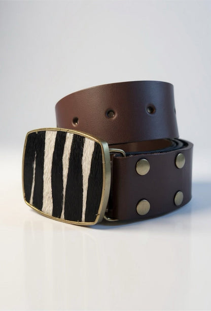 Brown leather belt with a zebra-striped buckle on a white background