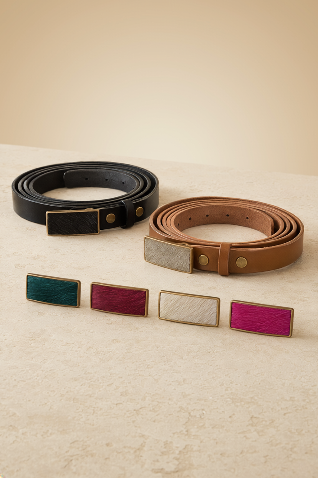 Buckle and Bound Slim belts pictured with assorted slim belt buckles. 