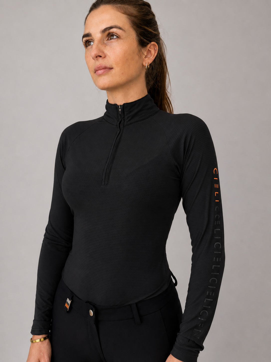 Side view of The Faye Baselayer in black with an athletic fit.