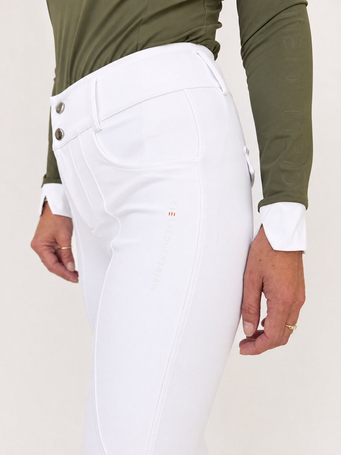 Close of up pocket and brand detailing of Juliette High Waisted Breggins (high waisted breeches) in white 