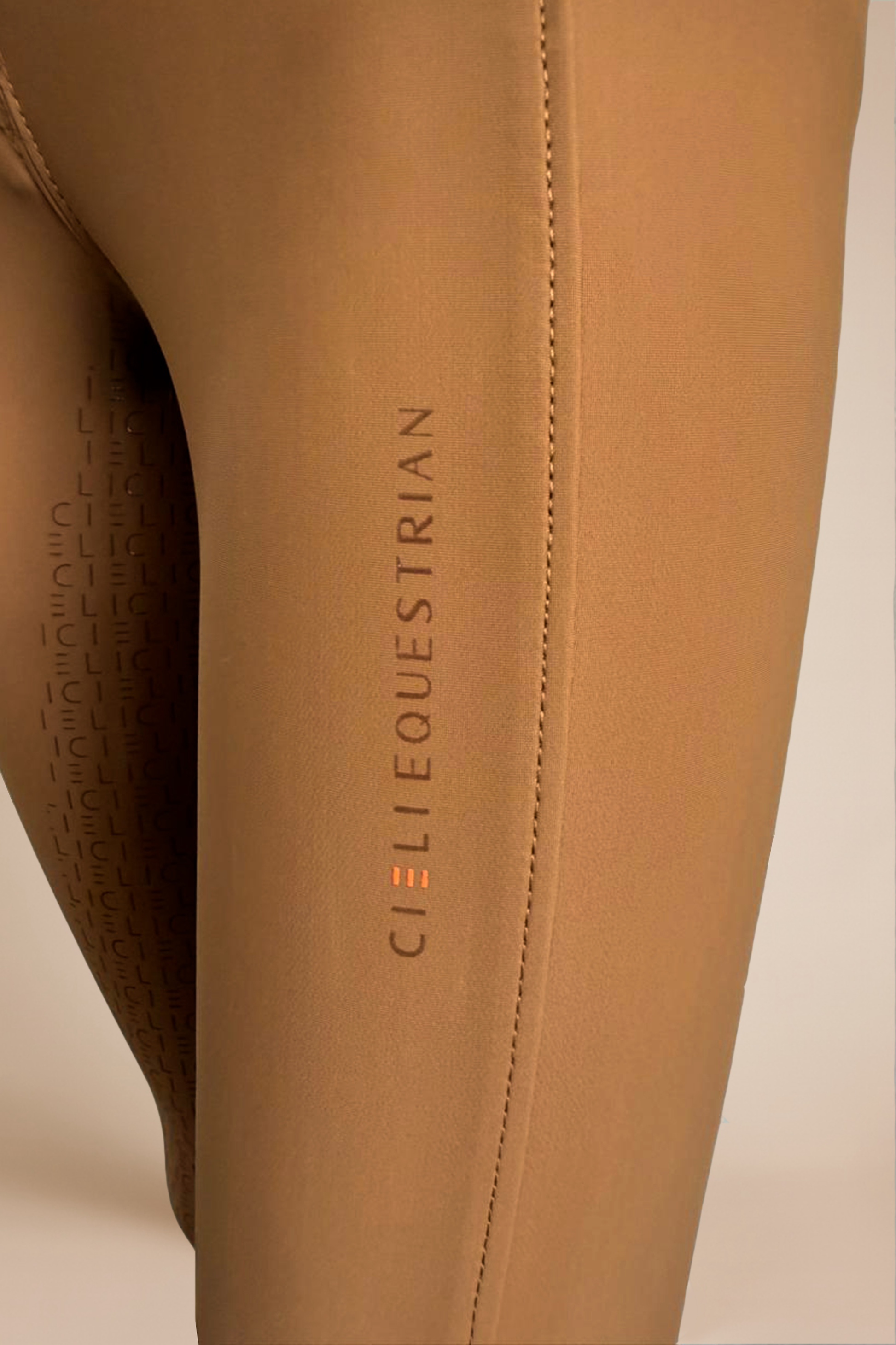 Close-up of brown equestrian pants with 'Cieli Equestrian' branding.