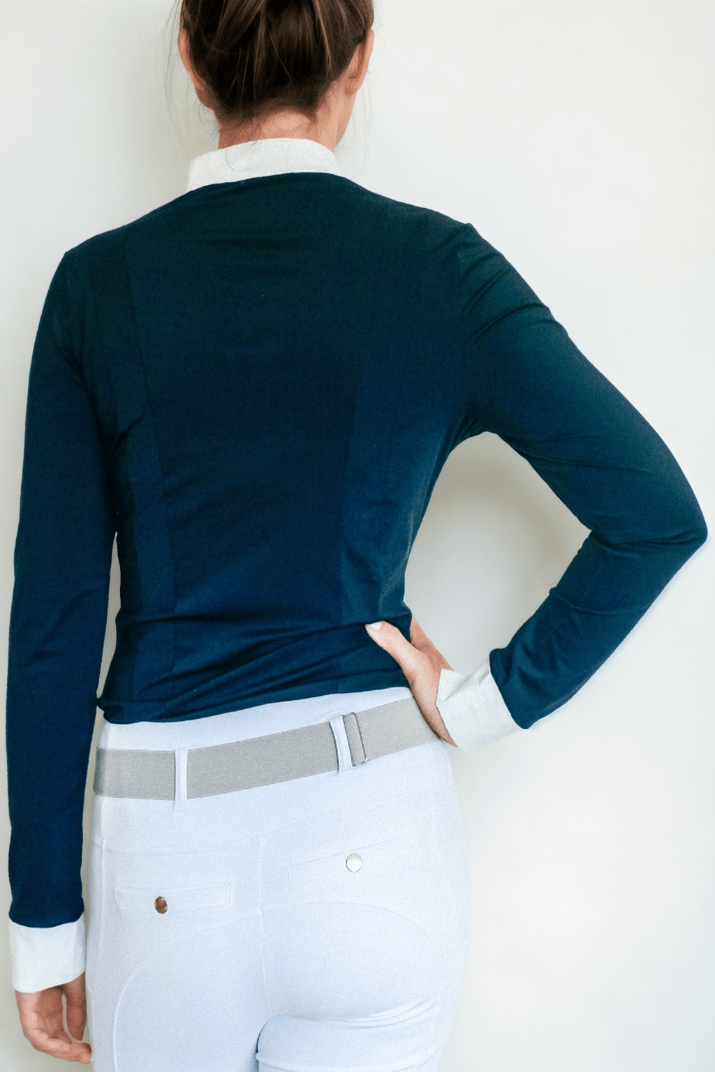 Back view of The Lia Show Shirt with back pleats in navy.